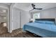 Comfortable bedroom with a ceiling fan, a cozy bed, and natural light, creating a relaxing atmosphere at 847 Quail Dr, Charleston, SC 29412