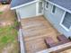 Aerial view of a backyard wood deck featuring outdoor seating and a painted brick home at 847 Quail Dr, Charleston, SC 29412