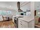 Bright kitchen with white cabinets, stainless appliances, and a view to the living room at 847 Quail Dr, Charleston, SC 29412