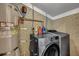 A functional laundry room with modern LG washer/dryer set and updated water heater at 847 Quail Dr, Charleston, SC 29412