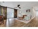 Inviting living room featuring hardwood floors, modern furniture, and a rustic barn door at 847 Quail Dr, Charleston, SC 29412