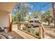 Relaxing covered porch with wooden railing, comfortable seating, and a view of the yard at 847 Quail Dr, Charleston, SC 29412