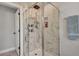 Modern shower with marble tile, glass enclosure, and multi-setting shower head, for a spa-like experience at 847 Quail Dr, Charleston, SC 29412