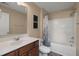 Full bathroom with wood vanity, shower-tub combo, and decorative accents at 9000 Hema Ln, Summerville, SC 29483