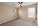 Cozy bedroom with neutral carpet, ceiling fan, and natural light at 9000 Hema Ln, Summerville, SC 29483
