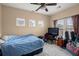 Neutral bedroom bathed in natural light from plentiful windows, with ceiling fan at 9000 Hema Ln, Summerville, SC 29483