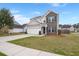 Charming two-story home with a brick and siding facade, well-manicured lawn, and a two-car attached garage at 9000 Hema Ln, Summerville, SC 29483