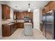 Charming kitchen features stainless steel appliances, tile backsplash, and a central island at 9000 Hema Ln, Summerville, SC 29483