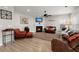 Spacious living room featuring an electric fireplace, ample seating, and a ceiling fan at 9000 Hema Ln, Summerville, SC 29483