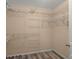 Empty walk-in closet with wood floor and adjustable wire shelving at 9000 Hema Ln, Summerville, SC 29483