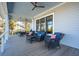 Comfortable porch seating with beautiful outdoor furniture and ceiling fan at 939 White Point Blvd, Charleston, SC 29412