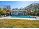 Beautiful backyard with a refreshing swimming pool, complemented by a manicured lawn and inviting patio area at 939 White Point Blvd, Charleston, SC 29412