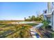 Spacious backyard featuring a pool, waterfront view, and lush landscaping at 939 White Point Blvd, Charleston, SC 29412