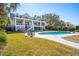 Expansive backyard featuring a sparkling pool and lush lawn, perfect for outdoor entertaining and relaxation at 939 White Point Blvd, Charleston, SC 29412