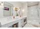 Elegant bathroom featuring double vanity, modern fixtures, and a glass-enclosed shower at 939 White Point Blvd, Charleston, SC 29412