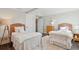 Charming bedroom featuring twin beds, neutral walls, and wood floors at 939 White Point Blvd, Charleston, SC 29412