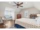 Bright bedroom featuring a window seat with views, dark wood floors, and neutral walls at 939 White Point Blvd, Charleston, SC 29412