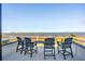 Outdoor deck with seating, table, and stunning waterfront views at 939 White Point Blvd, Charleston, SC 29412