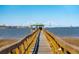 Picturesque dock leading to the water, providing stunning views of the city skyline and the iconic bridge at 939 White Point Blvd, Charleston, SC 29412