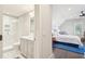 View of a well-appointed bathroom leading into a bright and cozy bedroom at 939 White Point Blvd, Charleston, SC 29412