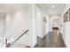 Bright hallway with hardwood floors, leading to a bedroom with an ensuite bathroom at 939 White Point Blvd, Charleston, SC 29412