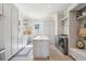 Well-lit laundry room with modern appliances, storage and folding counter at 939 White Point Blvd, Charleston, SC 29412