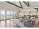 Spacious open-concept living room with water views, seamlessly connecting to the kitchen and dining areas at 939 White Point Blvd, Charleston, SC 29412