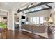 Bright living room with high ceilings, fireplace, built-in shelving, and doors leading to a balcony at 939 White Point Blvd, Charleston, SC 29412