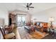 Cozy living room with vaulted ceilings, leather furniture, and a ceiling fan at 939 White Point Blvd, Charleston, SC 29412