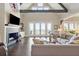 Comfortable living room with cathedral ceiling, beams, fireplace, and stunning view of the coast at 939 White Point Blvd, Charleston, SC 29412