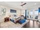 Bright main bedroom with hardwood floors, ceiling fan, french doors and lots of natural light at 939 White Point Blvd, Charleston, SC 29412