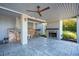 Covered patio featuring a fireplace, wood storage, and concrete flooring at 939 White Point Blvd, Charleston, SC 29412