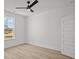 Minimalist bedroom design with a ceiling fan, new wood floors and natural lighting at 00 N Highway 17, McClellanville, SC 29458