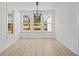 Bright dining room with elegant light fixture and large windows offering scenic views at 00 N Highway 17, McClellanville, SC 29458