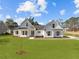 Charming new construction featuring white siding, a well-manicured lawn, and inviting curb appeal at 00 N Highway 17, McClellanville, SC 29458
