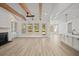 Spacious living room with fireplace, wood beams, and bright natural light at 00 N Highway 17, McClellanville, SC 29458