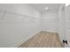 Spacious walk-in closet with wire shelving and laminate flooring at 00 N Highway 17, McClellanville, SC 29458