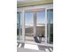 The light filled balcony with water views is accessible through sliding glass doors and is perfect for outdoor relaxation at 102 Mariners Cay Dr, Folly Beach, SC 29439
