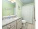 Bathroom featuring a vanity with granite countertop and a shower with a patterned curtain at 102 Mariners Cay Dr, Folly Beach, SC 29439