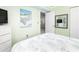 Bedroom with a TV and a mirror showing an adjacent living room at 102 Mariners Cay Dr, Folly Beach, SC 29439