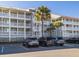 Exterior view of condos, showing balconies and parking lot at 102 Mariners Cay Dr, Folly Beach, SC 29439
