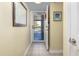 Hallway with an open door with a view to a balcony at 102 Mariners Cay Dr, Folly Beach, SC 29439