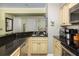 Efficient kitchen showcasing granite counters, stainless appliances, and plenty of cabinets for organized storage at 102 Mariners Cay Dr, Folly Beach, SC 29439