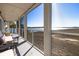 Inviting screened porch with seating, offering scenic waterfront views and tranquil outdoor living at 102 Mariners Cay Dr, Folly Beach, SC 29439