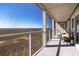 Spacious screened porch offers a serene view of the surrounding marshland and sky, perfect for relaxation at 102 Mariners Cay Dr, Folly Beach, SC 29439