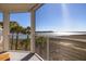 Serene screened-in porch features a scenic view of the water, perfect for relaxing and enjoying the coastal ambiance at 102 Mariners Cay Dr, Folly Beach, SC 29439