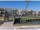 Condominiums with a tennis court with a beautiful gazebo and palm trees offer a relaxing place to play at 102 Mariners Cay Dr, Folly Beach, SC 29439