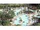 Aerial view of the community featuring water park, swimming pools, clubhouse, and lush landscaping at 1033 Swamp Rose Run, Summerville, SC 29485