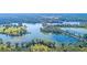Scenic aerial shot of a community lake surrounded by lush greenery and trees at 1033 Swamp Rose Run, Summerville, SC 29485