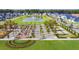 Aerial shot of the community, showcasing a pond and a planned park/green space at 1033 Swamp Rose Run, Summerville, SC 29485